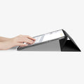 ACS09439 - iPad Pro 13-inch (2024) Case Liquid Air Folio in Black showing a person typing on the device while cover folded into a kickstand