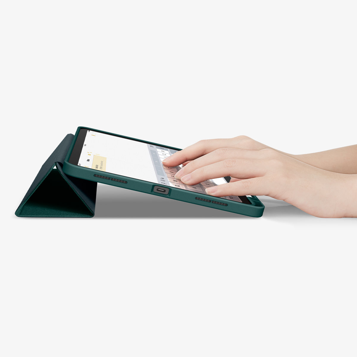 ACS07755 - iPad Air 11-inch (2025/2024) Case Urban Fit in Midnight Green showing a person's hand typing on the device screen while front case propped up as a built-in kickstand