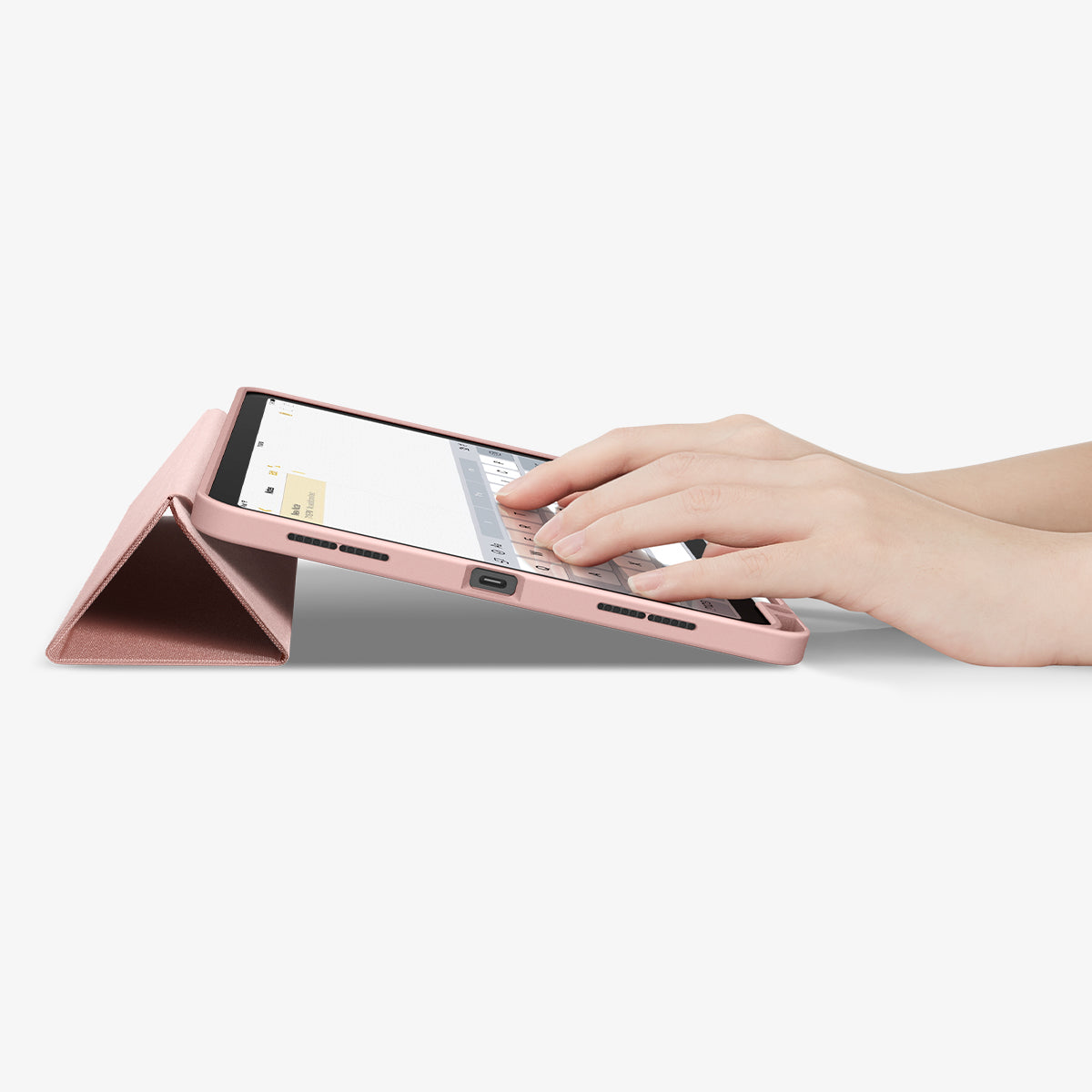 ACS07756 - iPad Air 11-inch (2025/2024) Case Urban Fit in Rose Gold showing a person's hand typing on the device screen while front case propped up as a built-in kickstand