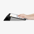 ACS01024 - iPad Pro 11-inch Case Rugged Armor Pro in Black showing the front and partial side of the device with folded cover converted into kickstand with a person's hand on the screen
