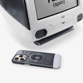 SPBD240001 - iPhone 15 Pro Max Case Classic C1 Bundle (MagFit) in Graphite Black showing the back and partial side beside an iMac device