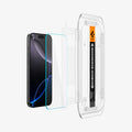 AGL07928 - iPhone 16 Pro GLAS.tR EZ Fit Sensor Protected showing the installation tray hovering in front of a screen film screen, screen protector and the device