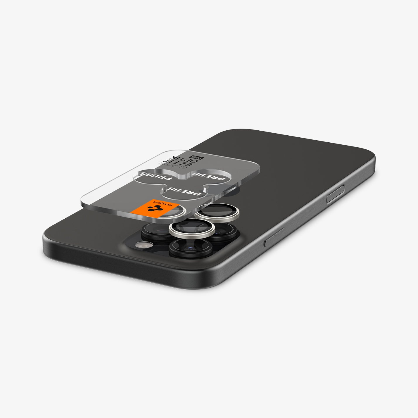 AGL08863 - iPhone 16 Pro Max / iPhone 16 Pro Optik Pro EZ Fit Lens Protector in Bright Silver showing the ez fit tray and lens protector hovering above the camera lens