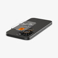 AGL08862 - iPhone 16 Pro Max Optik Pro EZ Fit Lens Protector in Desert Titanium showing the ez fit tray and lens protector hovering above the camera lens