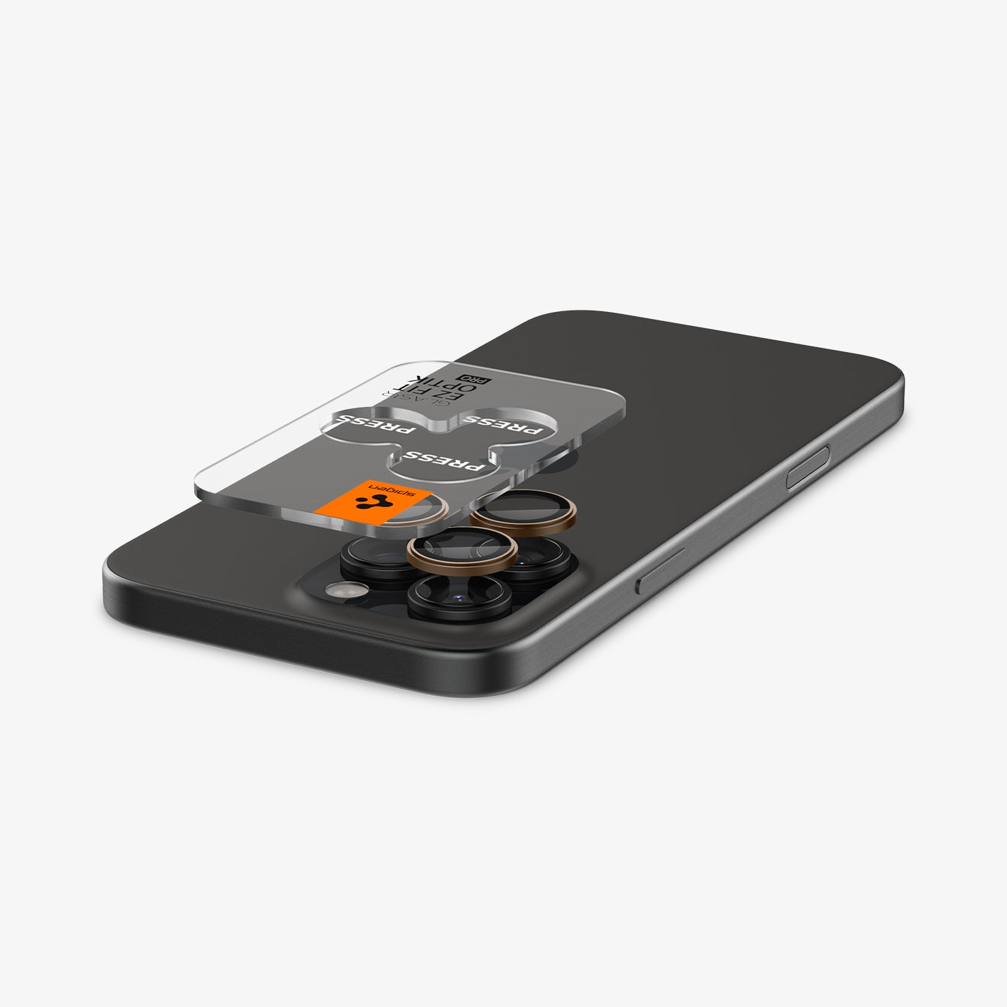 AGL08862 - iPhone 16 Pro Max Optik Pro EZ Fit Lens Protector in Desert Titanium showing the ez fit tray and lens protector hovering above the camera lens