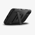 ACS08227 - iPhone 16 Case Slim Armor (MagFit) in Black showing the back, partial side and bottom, propped up with a built-in kickstand