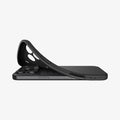 ACS09942 - iPhone 17 Pro Liquid Air in Matte Black showing the back, partially peeled off from the device on a flat surface