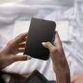 AGL12007 - iPhone Duo Glas.tR EZ Fit Pro showing the screen protector applied to a foldable display during everyday use.
