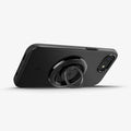 ACS09135 - iPhone 16e Case Thin Fit (MagFit) in Black showing the back, partial side with o-mag ring installed, propped up as a stand