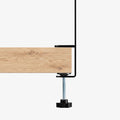 AHP11400 - Clamp Pegboard | LD405 showing close up of single clamp leg gripping edge of wooden desk with threaded bolt and star knob tightened