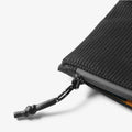 AFA11229 - Soft Card Holder | LF300 in Black showing close-up of the bottom corner zipper detail with braided cord pull tab and yellow interior lining visible.