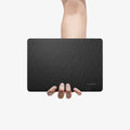 ACS06958 - MacBook Air 15-inch Case Urban Fit in Black showing the top of the device held by a person's hand