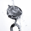ACP11658 - Spigen Magnetic Car Mount (Mag Fit) MFT 36-1 showing water splashing over the suction base and magnetic ring to highlight durability