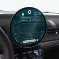 AGL09280 - Spigen display protector on a MINI Cooper's round dashboard screen, viewed at an angle near the steering wheel and rearview mirror