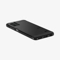 ACS07767 - Moto G 5G (2024) Case Tough Armor in Black showing the back, partial side with side buttons and bottom on a flat surface
