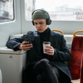 AMP09029 - MagSafe Phone Holder Nano Pop (MagFit) in Black Sesame showing a person holding the device comfortably and securely with phone ring
