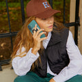 AMP09030 - MagSafe Phone Holder Nano Pop (MagFit) in Grape Purple showing a person holding the phone comfortably with phone holder