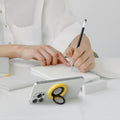 AMP09032 - MagSafe Phone Holder Nano Pop (MagFit) in Truffle Gray showing the a person propping up the phone holder's ring as a stand