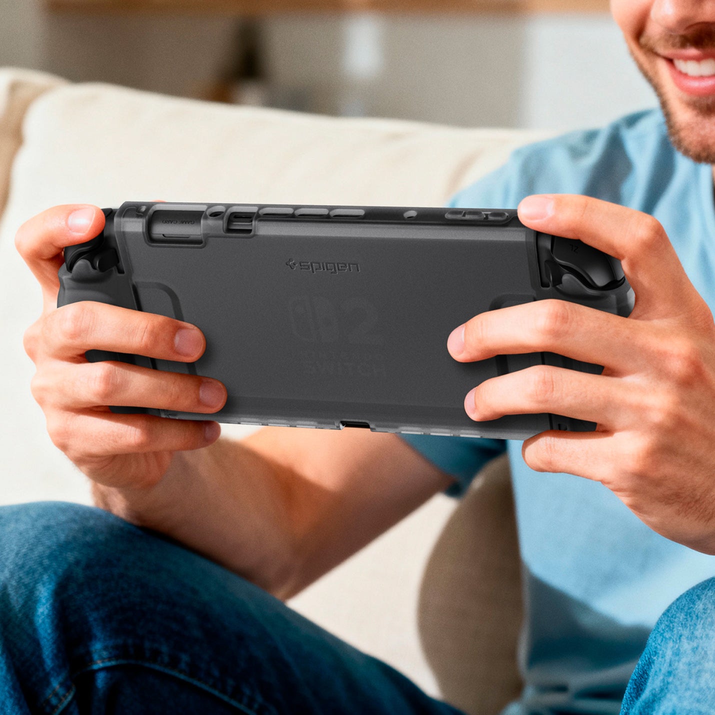 ACS10167 - Nintendo Switch 2 Ultra Hybrid case held in hands during handheld gaming on a couch