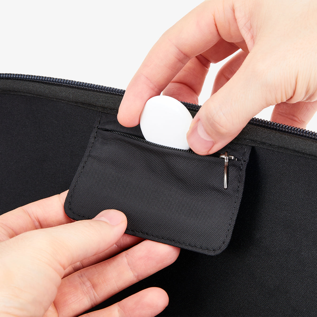 AGP09077 - Nintendo Switch 2 Klasden Pouch in Charcoal Gray showing the built-in AirTag storage