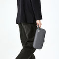 AGP09077 - Nintendo Switch 2 Klasden Pouch in Charcoal Gray showing a man holding the pouch with ease and comfort