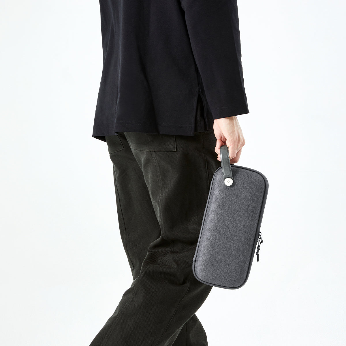 AGP09077 - Nintendo Switch 2 Klasden Pouch in Charcoal Gray showing a man holding the pouch with ease and comfort