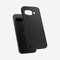 ACS09037 - Pixel 9a Case Thin Fit (MagFit) in Black showing the back, partial side and bottom hovering in front of the device