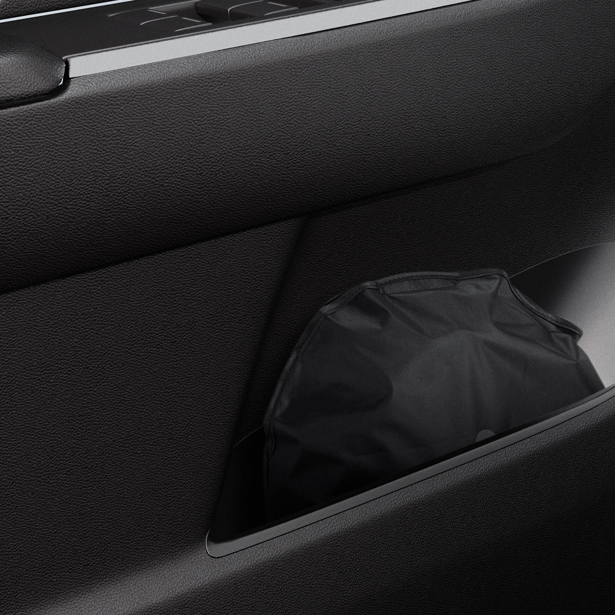 ACP09093 - R1S (2022-2025) Rivian CryoShade RO260 in Black showing the sunshade stored in a small space of the vehicle