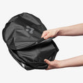 ACP09093 - R1S (2022-2025) Rivian CryoShade RO260 in Black showing the detaching of the velcro strap while attempting to unpack the shade