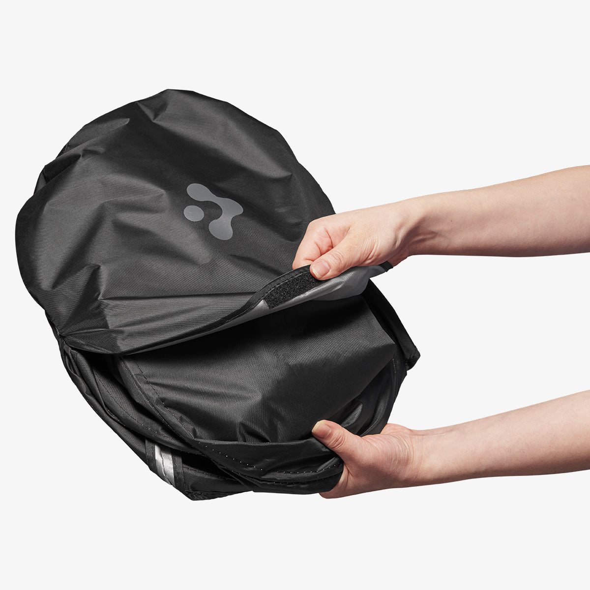 ACP09093 - R1S (2022-2025) Rivian CryoShade RO260 in Black showing the detaching of the velcro strap while attempting to unpack the shade