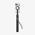 AMP11372 - Selfie Stick | S582W in Black showing a compact handheld form with mounted smartphone, magnetic ring holder, and attached wrist strap.