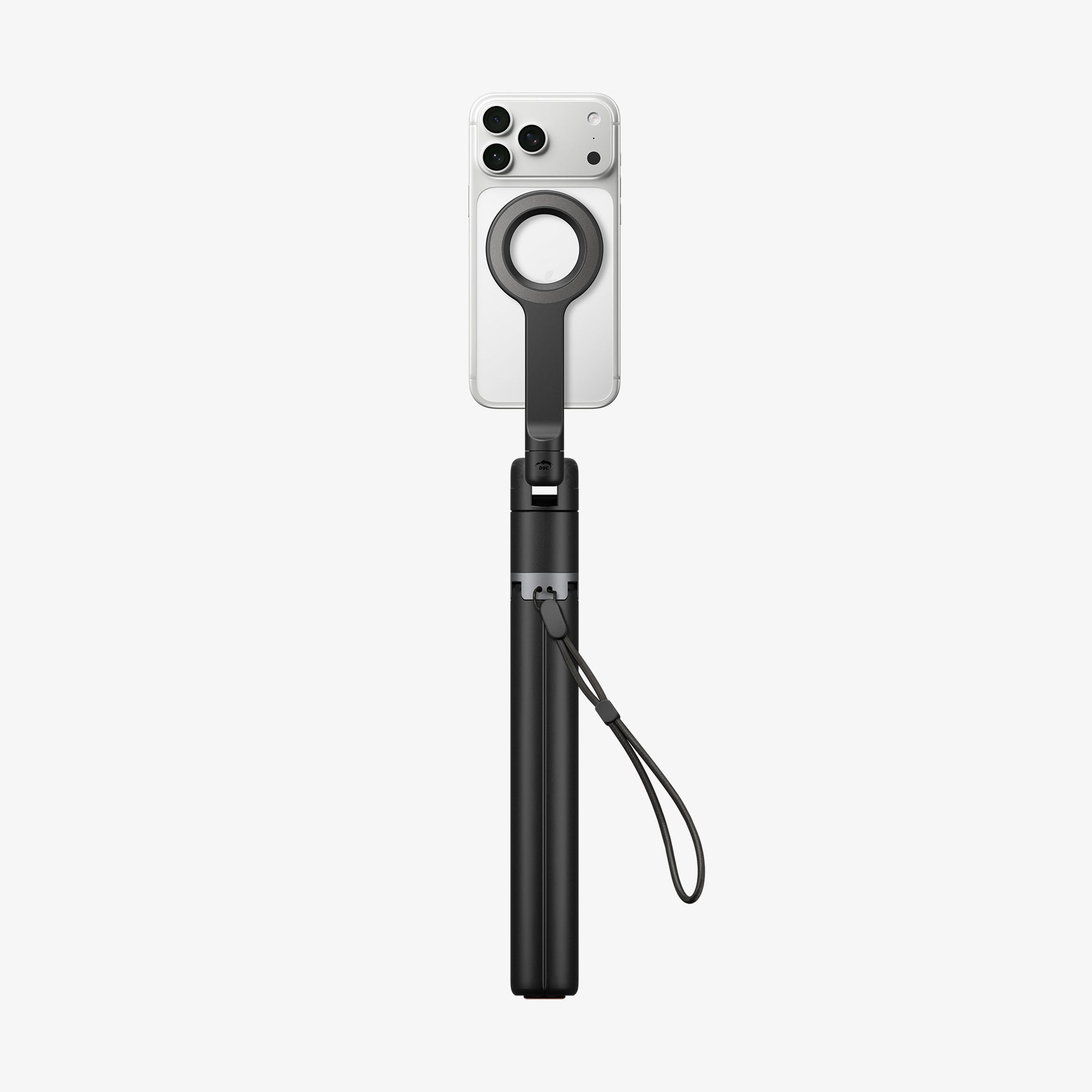 AMP11372 - Selfie Stick | S582W in Black showing a compact handheld form with mounted smartphone, magnetic ring holder, and attached wrist strap.