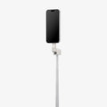 AMP11373 - Selfie Stick | S582W in Dune Beige showing a smartphone mounted vertically on an extended telescopic pole with an adjustable hinge for flexible angle positioning.