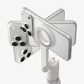 AMP11373 - Selfie Stick | S582W in Dune Beige showing a magnetic phone mount holding multiple smartphones in a radial arrangement to highlight compatibility and secure attachment.