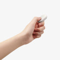 AMP11373 - Selfie Stick | S582W in Dune Beige showing a handheld wireless remote control with a single-button design for easy photo capture.