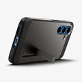 ACS09009 - Galaxy S25 Case Tough Armor AI (MagFit) in Gunmetal showing the back, partial bottom with built-in kickstand propped up