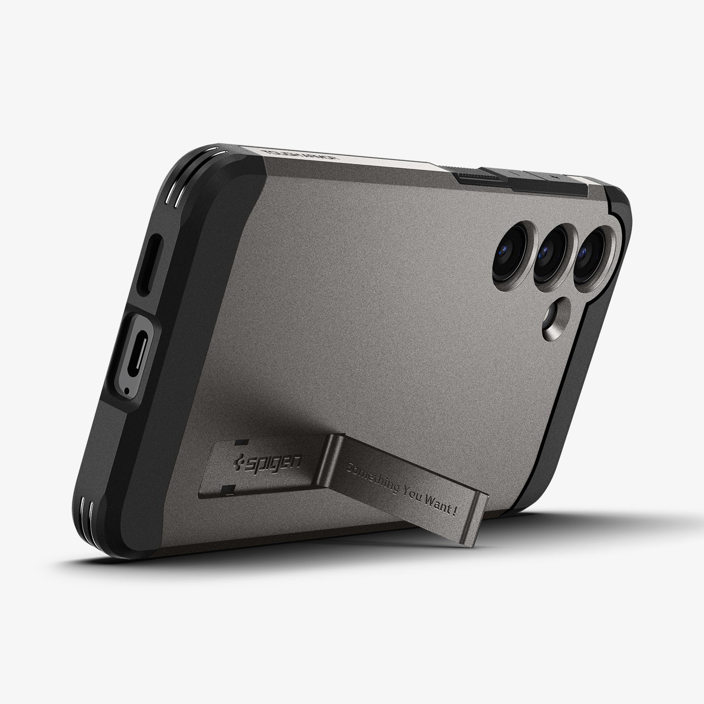ACS07356 - Galaxy S24 Case Tough Armor in Gunmetal showing the back, partial side and bottom with a built-in kickstand propped up