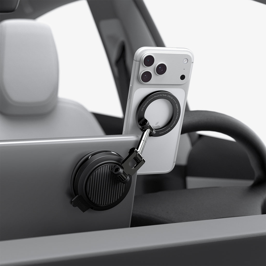 ACP11657 - Spigen MagSafe car mount holding iPhone on Tesla screen edge with suction cup base
