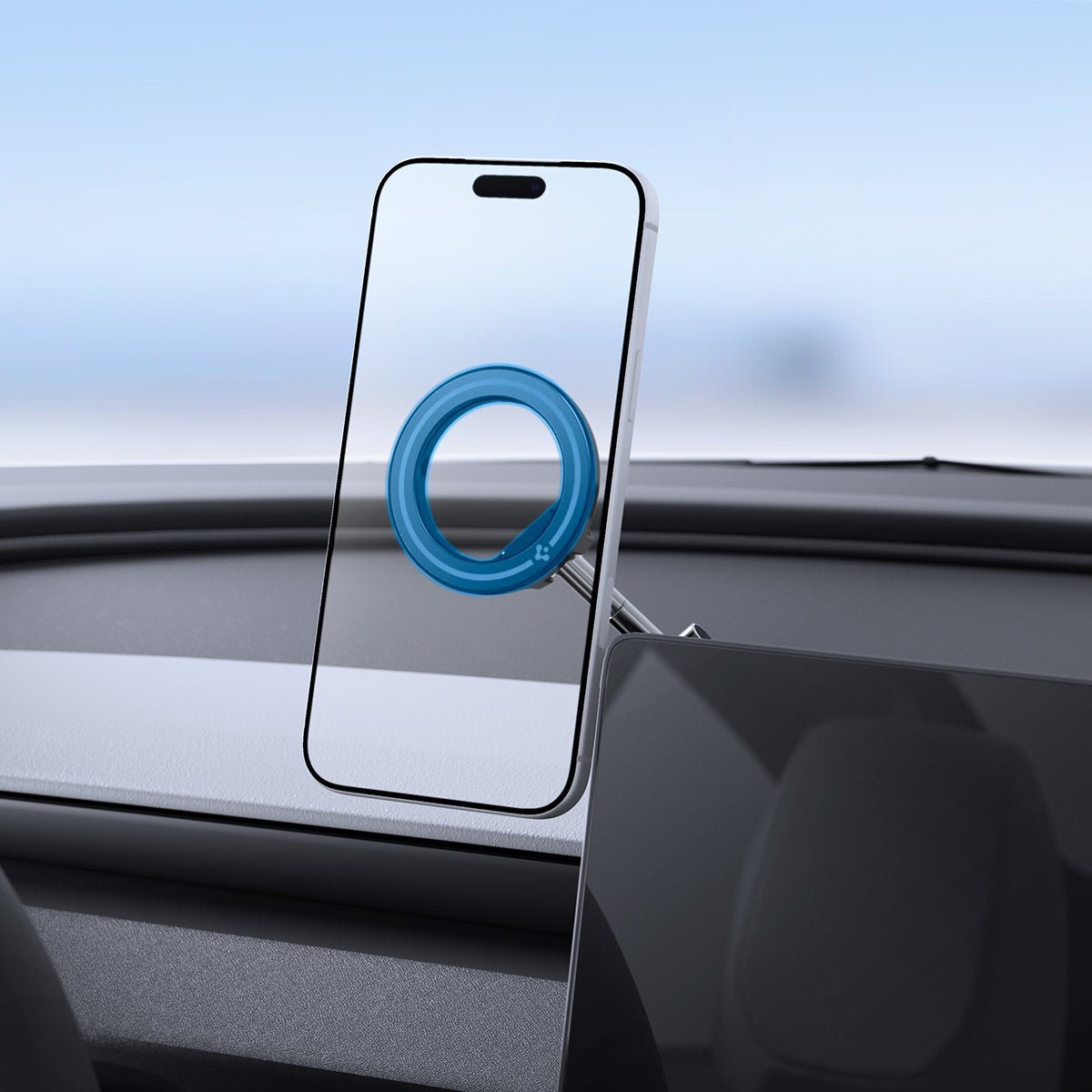 ACP11657 - Spigen MagSafe car mount holding iPhone on dashboard with magnetic ring attachment