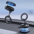 ACP11839 - Spigen STK120 mounts on a car windshield, with one magnetic ring detaching from its suction base