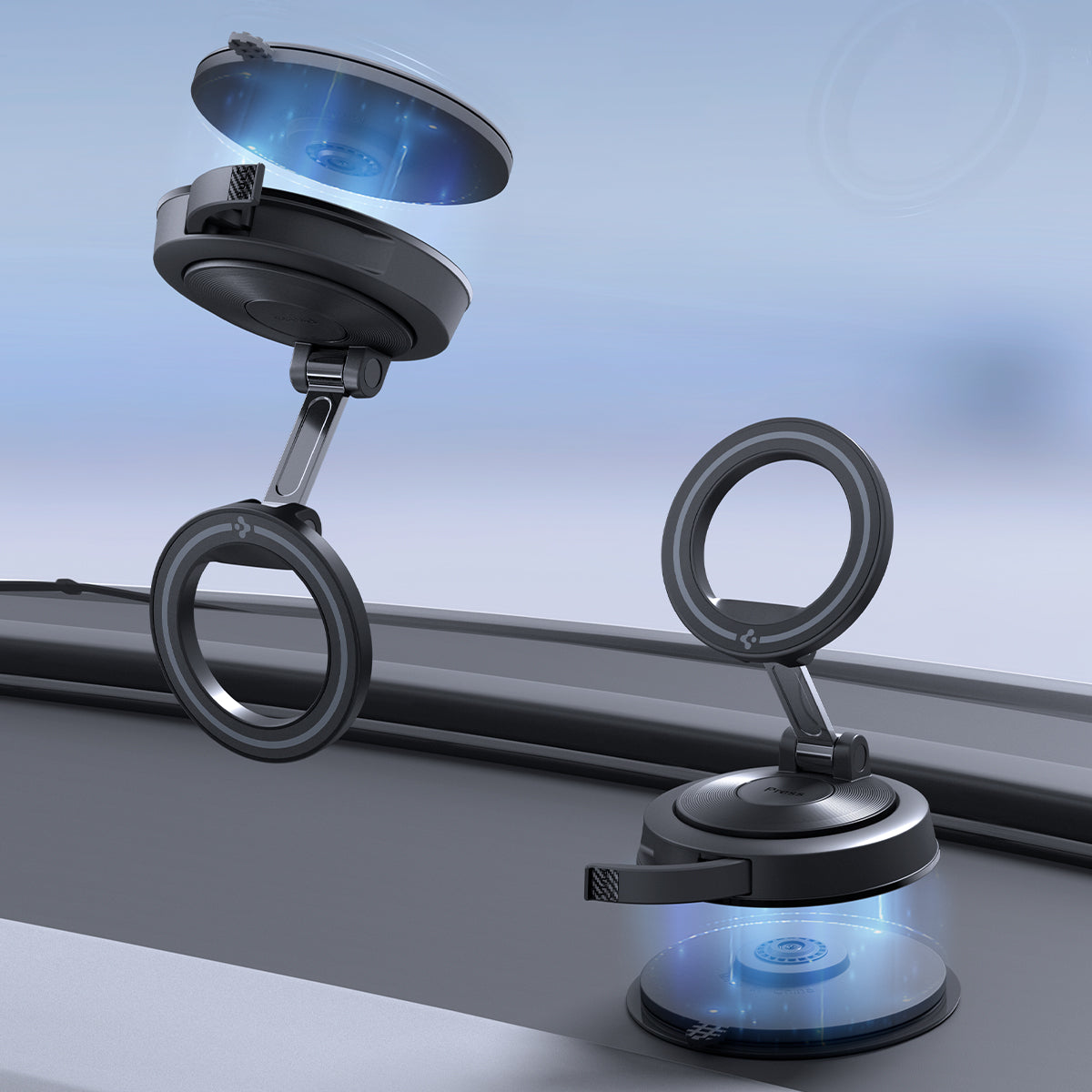 ACP11839 - Spigen STK120 mounts on a car windshield, with one magnetic ring detaching from its suction base