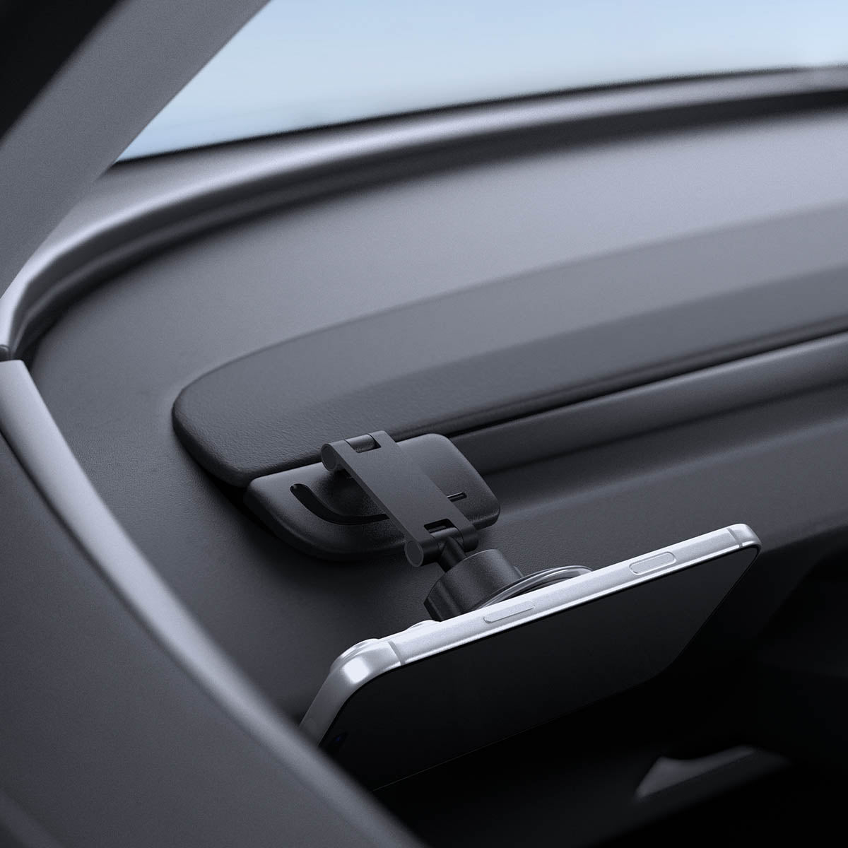 ACP11873 - Close-up angled view of the Spigen magnetic phone mount folded down with a phone attached at a low profile