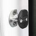 ACP07123 - Tesla Model Y & 3 Door Lock Cover TO320 in Black showing the door lock cover hovering in front of the door striker hook
