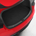 ACP11540 - Black Spigen bumper scuff plate installed along the trunk opening edge of a red Tesla Model 3