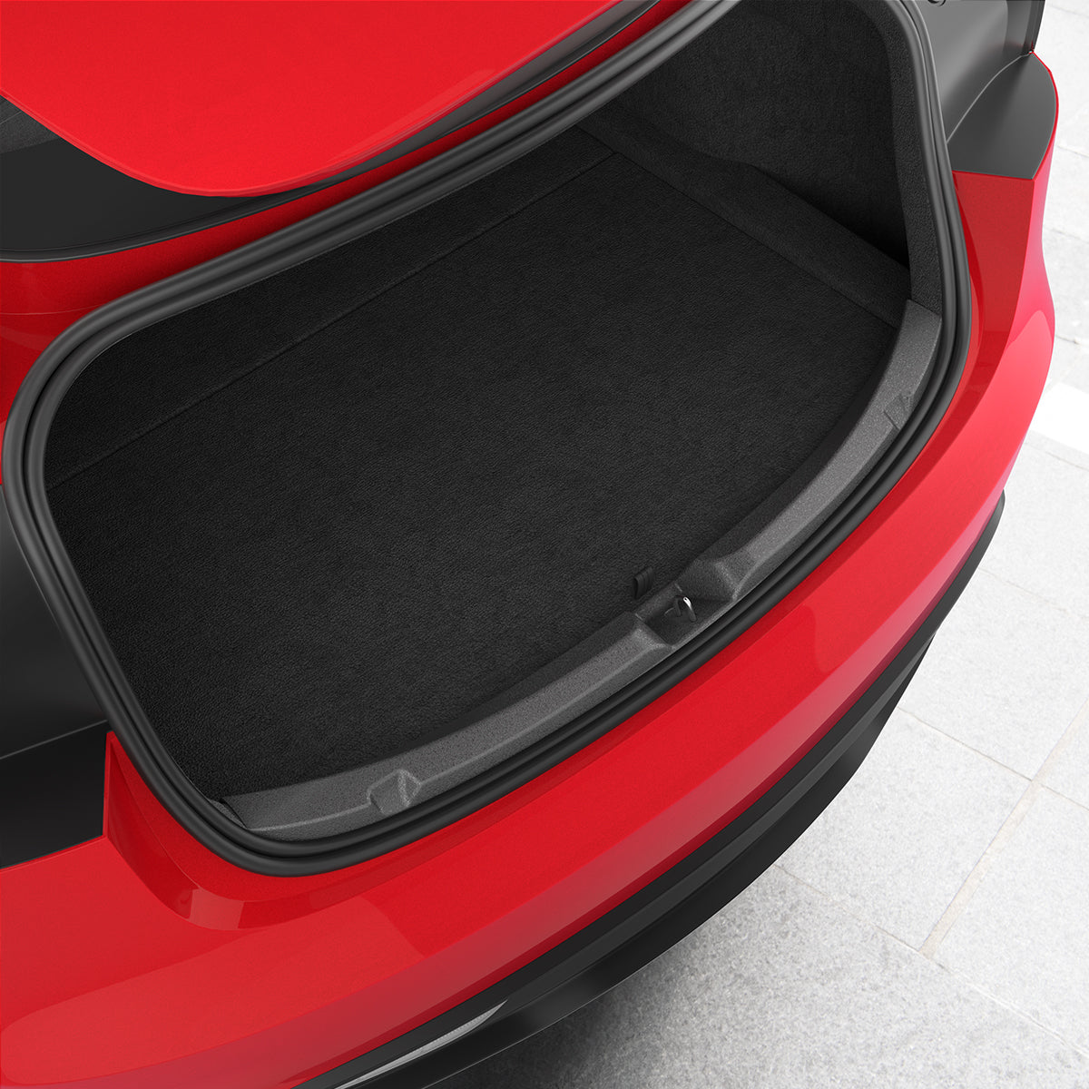 ACP11540 - Black Spigen bumper scuff plate installed along the trunk opening edge of a red Tesla Model 3