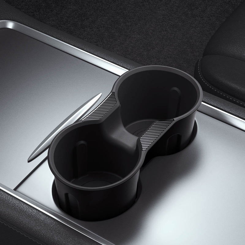 ACP07107 - Tesla Model 3 & Y Cup Holder Insert showing the cup holder insert hovering slightly above inside of car