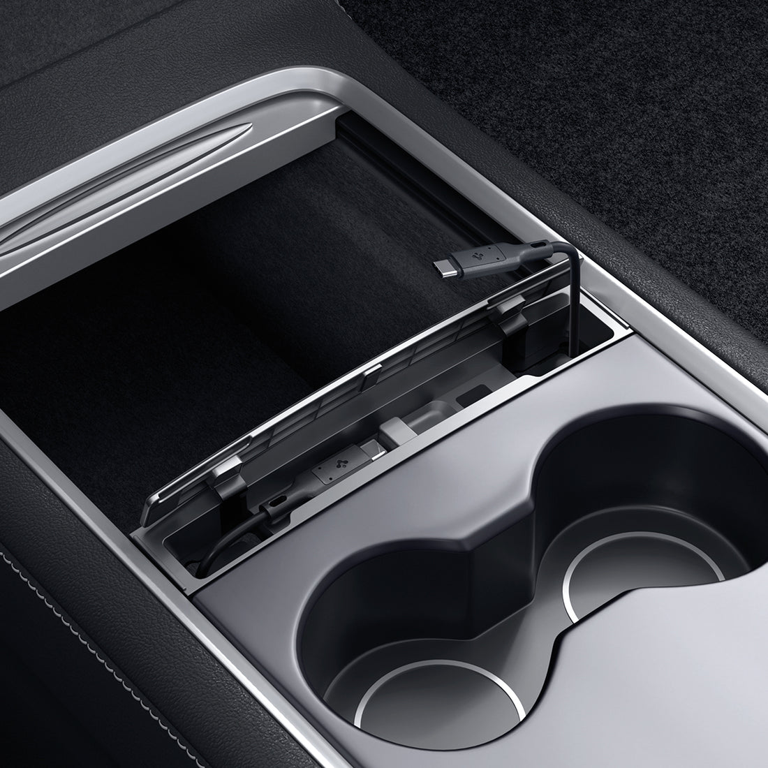 ACP07085 - Tesla Model Y & 3 Cable Organizer Station TO271 in Dark Silver showing the installed cable organizer with cable hovering above 