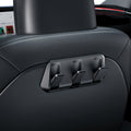 ACP09201 - Tesla Model 3 (2017-2023) Car Seat Hook TO283 in Black showing the front partial side installed at the back of the driver's seat
