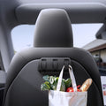 ACP09201 - Tesla Model 3 (2017-2023) Car Seat Hook TO283 in Black showing the front with grocery bag hanging on the hook