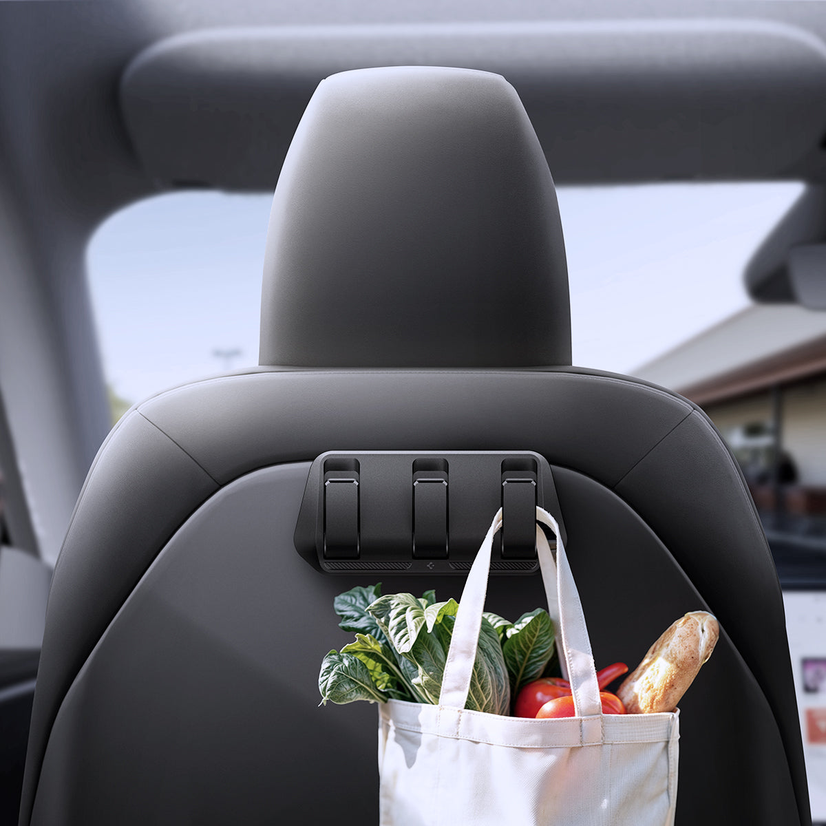 ACP09201 - Tesla Model 3 (2017-2023) Car Seat Hook TO283 in Black showing the front with grocery bag hanging on the hook